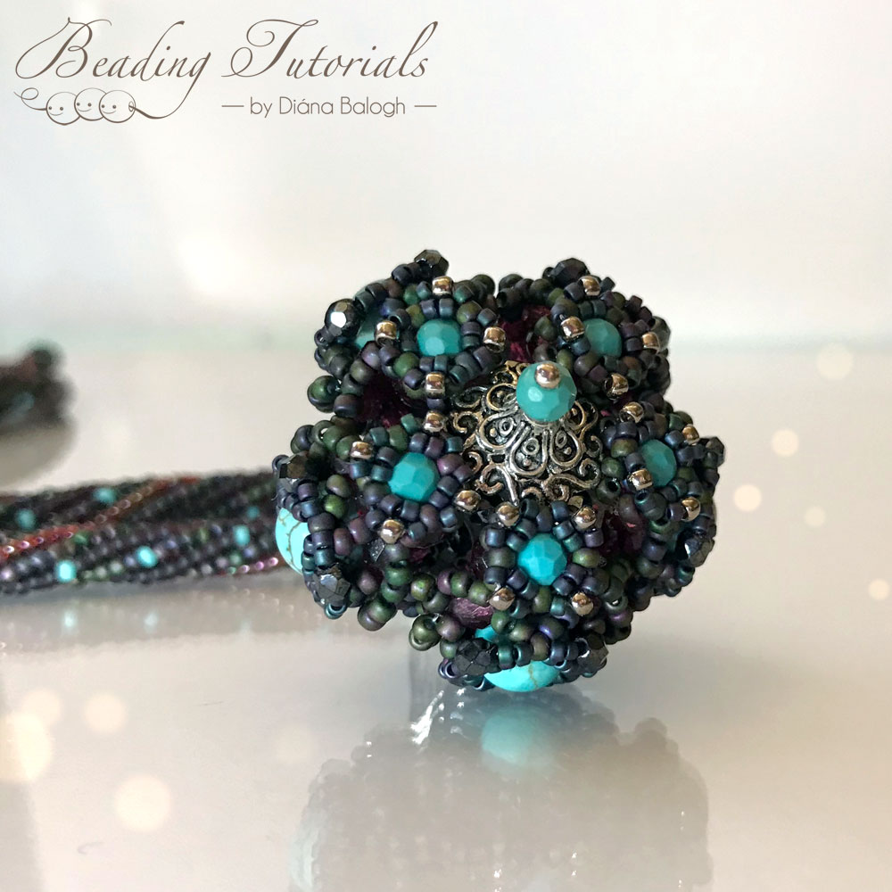 Aglio beaded bead in turquoise and purple designed by Diána Balogh